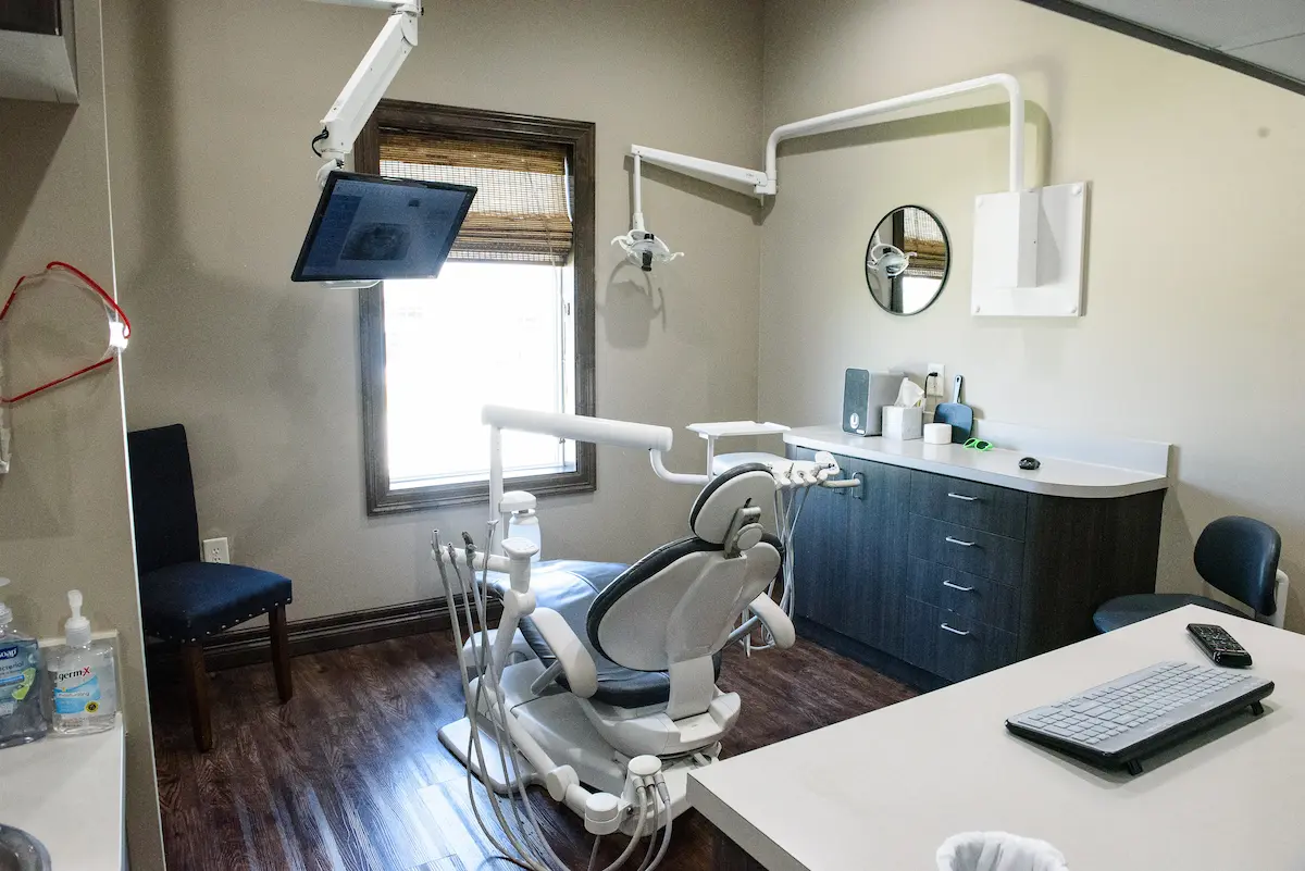 Modern dental exam room with patient chair, X-ray monitor, and organized cabinetry—designed for comfort, precision, and efficient dental care